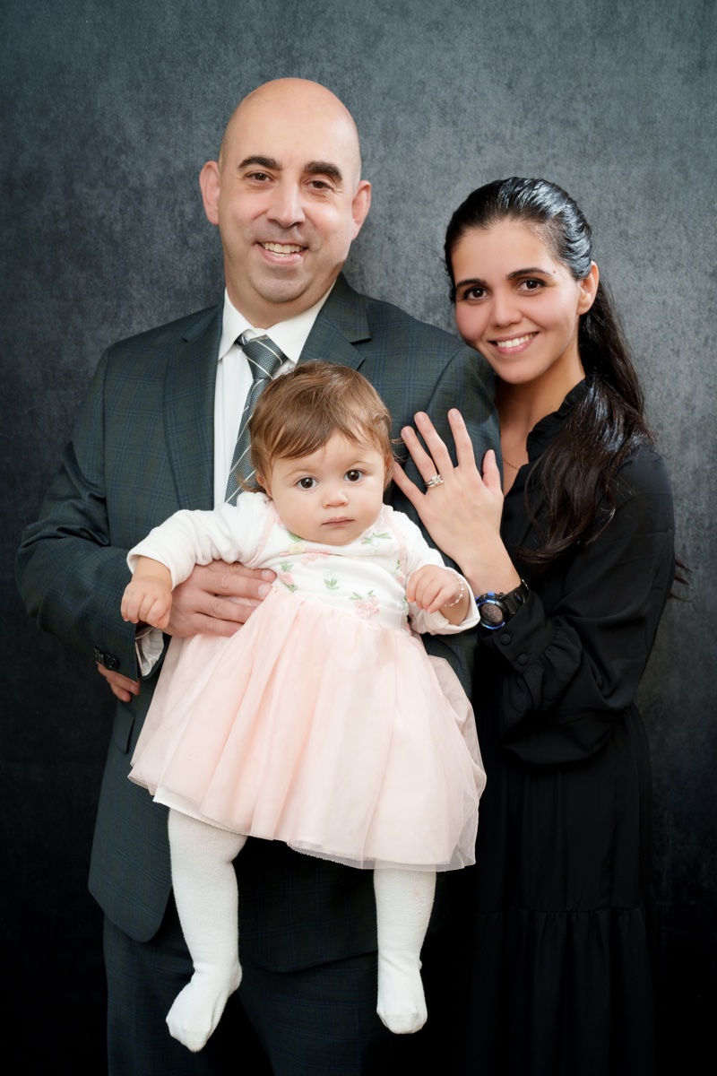 Stephen Bandar with his wife and daughter